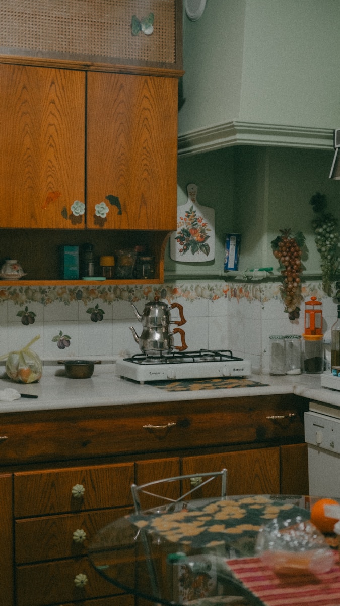 a kitchen with a stove top oven next to a counter